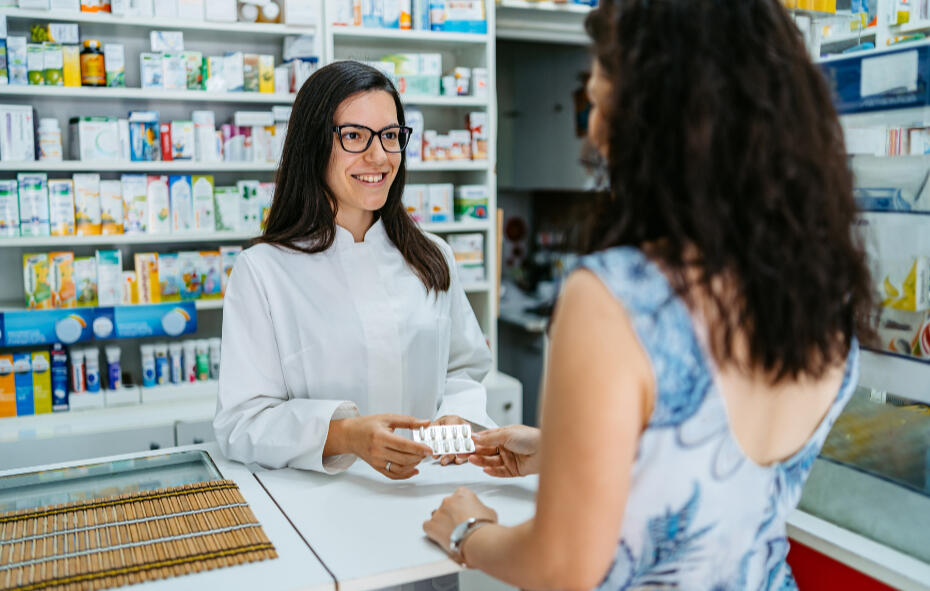 Pharamacist talking to her patient